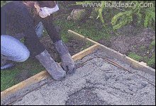 Reinforcing steel being placed into wet concrete