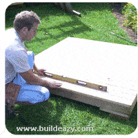 levelling the playhouse floor and standing the walls 1