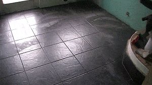 Bathroom Do-Over :  Floor Smoothed and Tiles Down