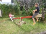 Seesaw with sliding seats